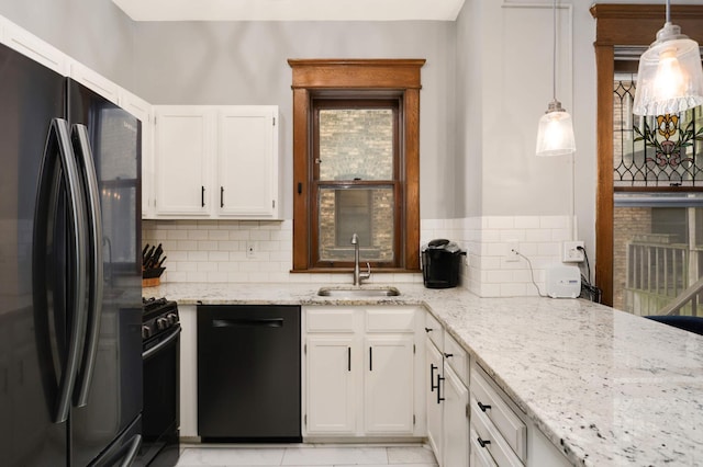 635 Grand Ave Unit 4, Saint Paul, MN 55105 - kitchen featuring black appliances, a sink, white cabinets, light stone counters, and tasteful backsplash