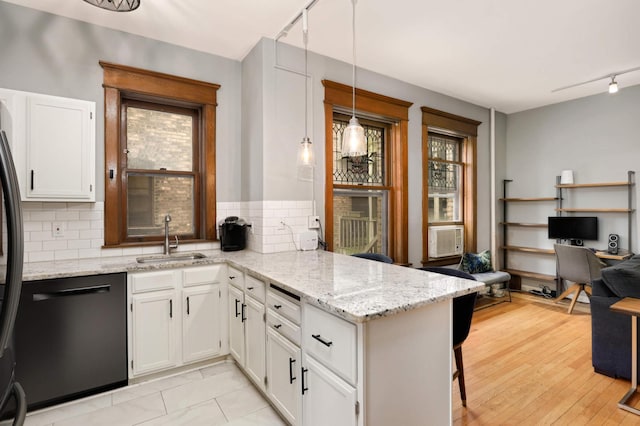 635 Grand Ave Unit 4, Saint Paul, MN 55105 - kitchen with track lighting, a sink, dishwasher, a peninsula, and tasteful backsplash