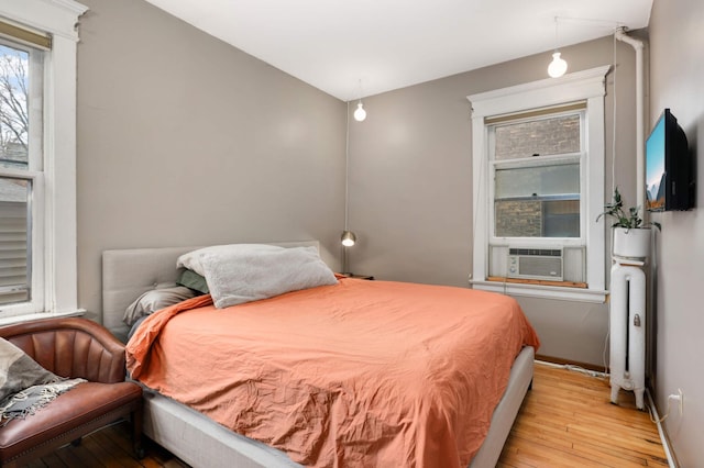635 Grand Ave Unit 4, Saint Paul, MN 55105 - bedroom featuring cooling unit, light wood-style flooring, and baseboards