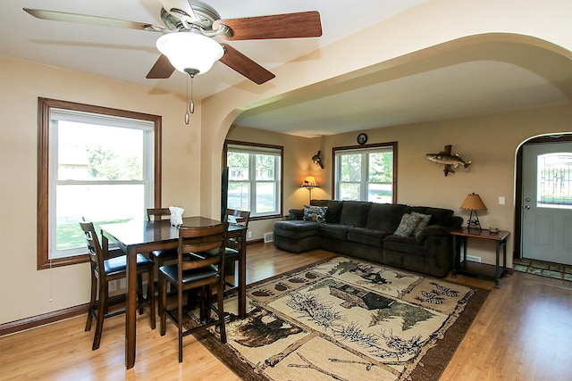 340 5th Ave SW, Hutchinson, MN 55350 - living area featuring arched walkways, light wood finished floors, and a ceiling fan
