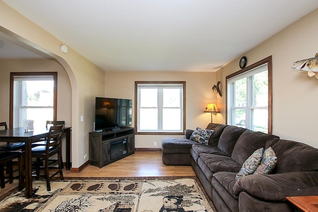 340 5th Ave SW, Hutchinson, MN 55350 - living room with light wood-style flooring and arched walkways