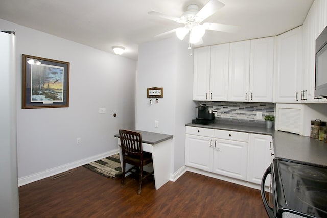 340 5th Ave SW, Hutchinson, MN 55350 - kitchen with range, dark countertops, dark wood-type flooring, a ceiling fan, and white cabinets