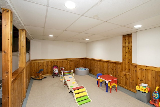 340 5th Ave SW, Hutchinson, MN 55350 - rec room with a wainscoted wall, carpet floors, recessed lighting, a paneled ceiling, and wooden walls