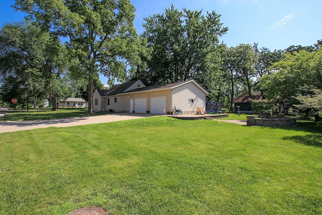 340 5th Ave SW, Hutchinson, MN 55350 - view of front of property with an attached garage, concrete driveway, and a front lawn