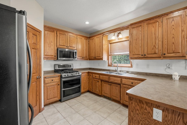25100 Lincoln Dr NE, Athens Twp, MN 55040 - kitchen featuring stainless steel appliances, a sink, light tile patterned flooring, brown cabinetry, and recessed lighting