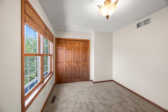 25100 Lincoln Dr NE, Athens Twp, MN 55040 - unfurnished bedroom with carpet, baseboards, and a closet