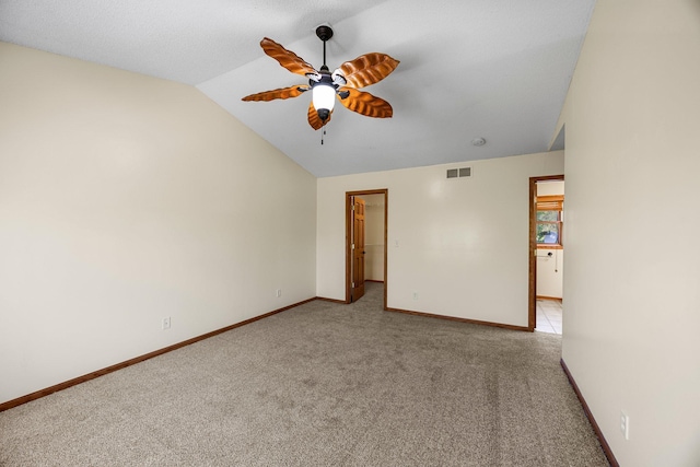 25100 Lincoln Dr NE, Athens Twp, MN 55040 - spare room featuring light colored carpet, lofted ceiling, a ceiling fan, and baseboards