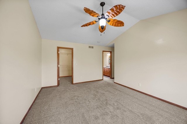 25100 Lincoln Dr NE, Athens Twp, MN 55040 - empty room featuring lofted ceiling, light carpet, baseboards, and ceiling fan