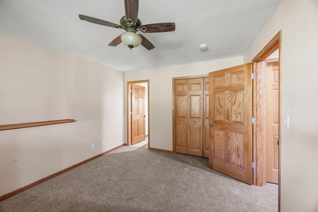 25100 Lincoln Dr NE, Athens Twp, MN 55040 - unfurnished bedroom with carpet flooring, a closet, baseboards, and ceiling fan