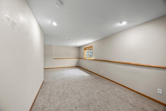 25100 Lincoln Dr NE, Athens Twp, MN 55040 - carpeted spare room with baseboards, a smoke detector, and recessed lighting