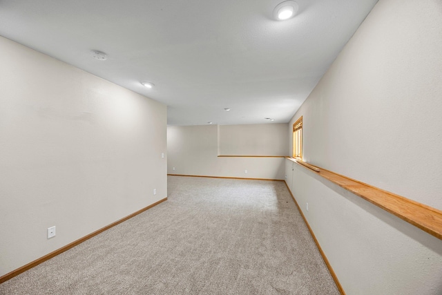 25100 Lincoln Dr NE, Athens Twp, MN 55040 - unfurnished room featuring light colored carpet, baseboards, a smoke detector, and recessed lighting