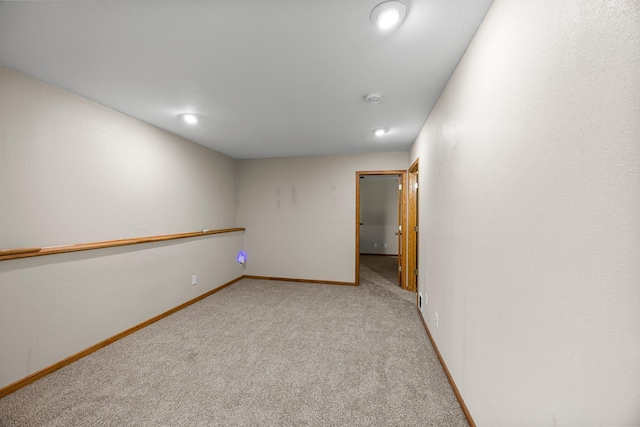 25100 Lincoln Dr NE, Athens Twp, MN 55040 - empty room with light colored carpet, baseboards, a smoke detector, and recessed lighting
