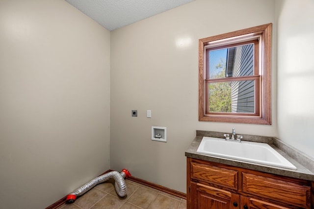 25100 Lincoln Dr NE, Athens Twp, MN 55040 - washroom featuring electric dryer hookup, baseboards, light tile patterned flooring, cabinet space, and hookup for a washing machine