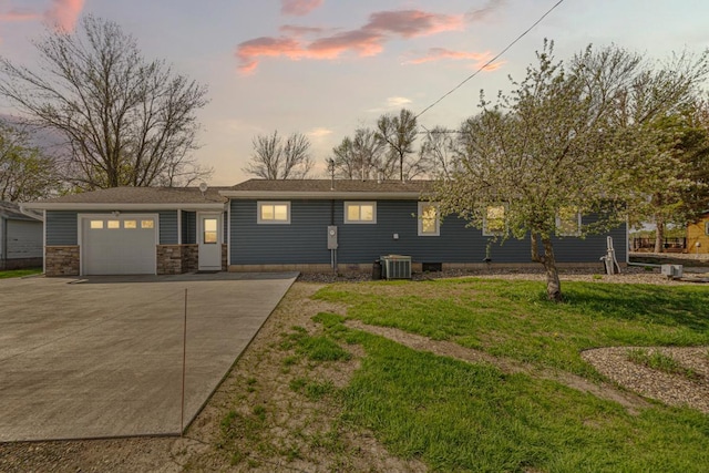 17055 Dickenson Ln, Waterville, MN 56096 - single story home with concrete driveway, central AC, a garage, and a yard