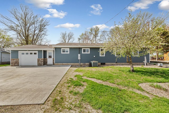 17055 Dickenson Ln, Waterville, MN 56096 - view of front of house with central AC unit, concrete driveway, a front yard, and an attached garage
