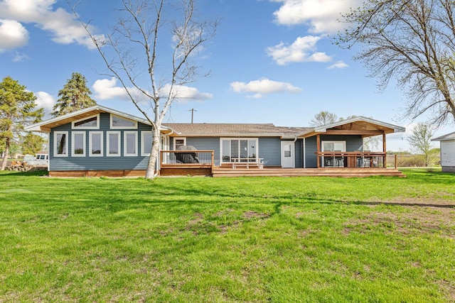 17055 Dickenson Ln, Waterville, MN 56096 - back of property with a wooden deck and a lawn