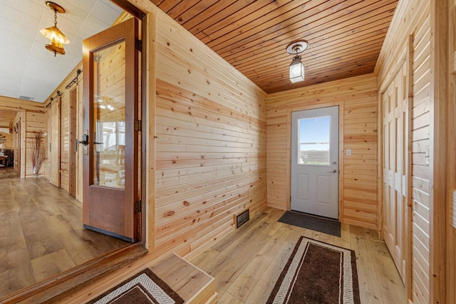 17055 Dickenson Ln, Waterville, MN 56096 - doorway to outside featuring light wood-style floors, wooden walls, and wood ceiling