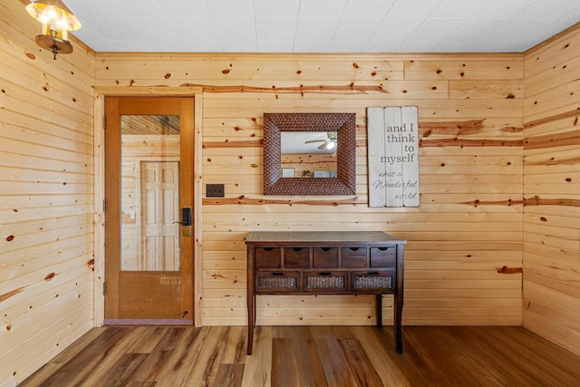17055 Dickenson Ln, Waterville, MN 56096 - unfurnished room featuring wooden walls and wood finished floors