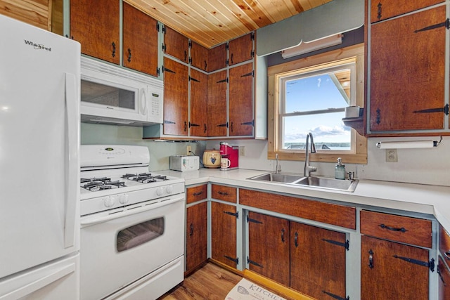 17055 Dickenson Ln, Waterville, MN 56096 - kitchen with white appliances, a sink, light countertops, wooden ceiling, and light wood-style flooring