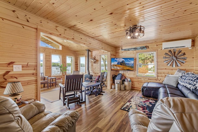 17055 Dickenson Ln, Waterville, MN 56096 - living room with wood walls, a wall mounted air conditioner, plenty of natural light, wood finished floors, and wood ceiling