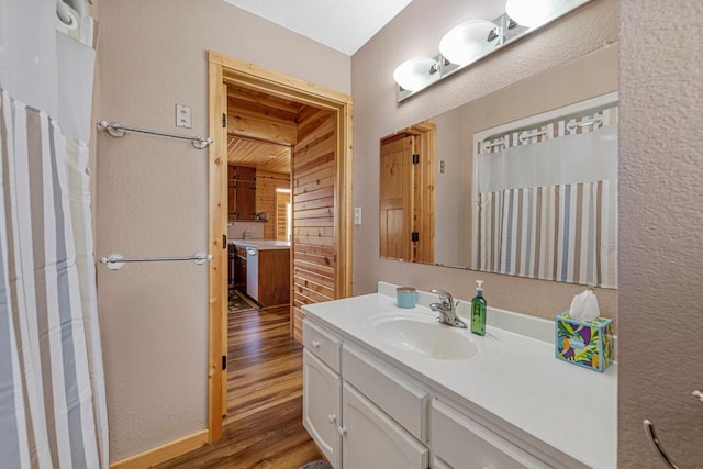 17055 Dickenson Ln, Waterville, MN 56096 - bathroom featuring wood finished floors and vanity