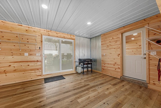 17055 Dickenson Ln, Waterville, MN 56096 - empty room with wooden walls, hardwood / wood-style flooring, wood ceiling, and recessed lighting