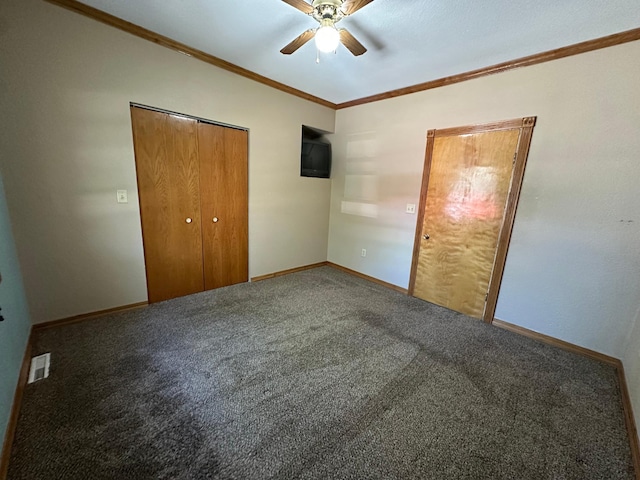 403 7th St N, Kerkhoven, MN 56252 - unfurnished bedroom featuring carpet flooring, ornamental molding, baseboards, a closet, and a ceiling fan