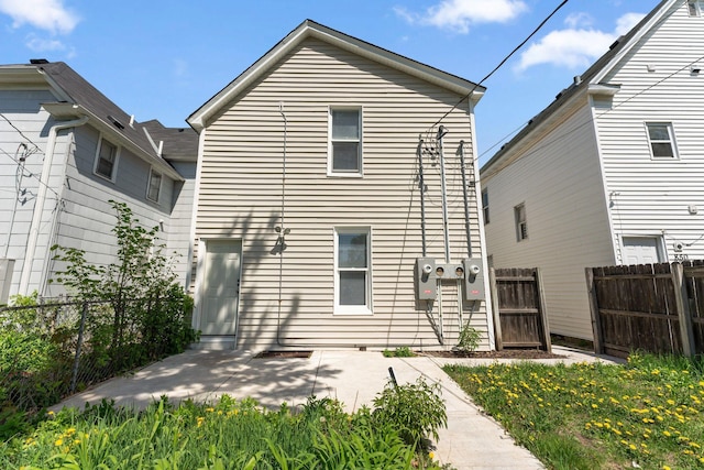 852 Edmund Ave, Saint Paul, MN 55104 - rear view of house with a patio area and fence