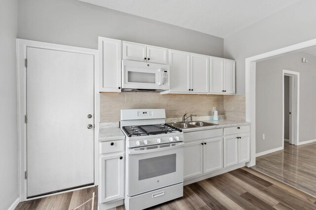 852 Edmund Ave, Saint Paul, MN 55104 - kitchen with white appliances, a sink, light countertops, and decorative backsplash