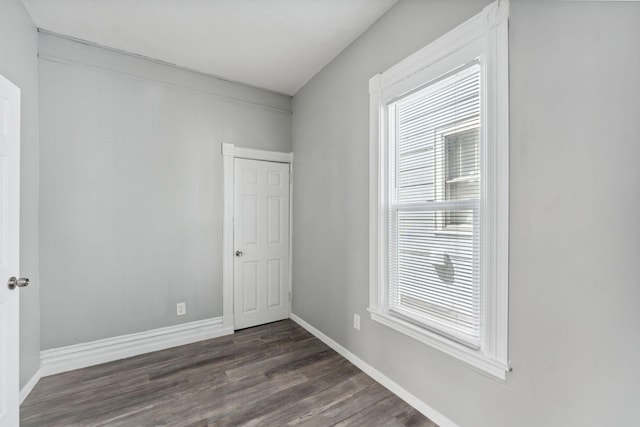 852 Edmund Ave, Saint Paul, MN 55104 - unfurnished room with dark wood-type flooring, plenty of natural light, and baseboards