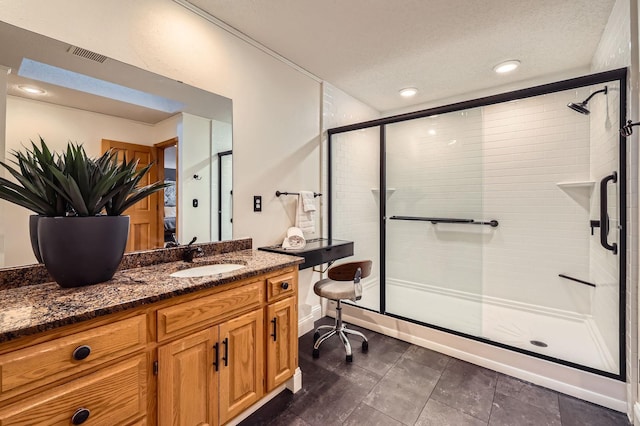 58 Garden Dr, Burnsville, MN 55337 - bathroom with a shower stall, vanity, and a textured ceiling