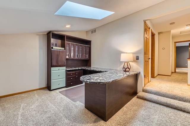 58 Garden Dr, Burnsville, MN 55337 - home office with carpet, built in study area, baseboards, and lofted ceiling