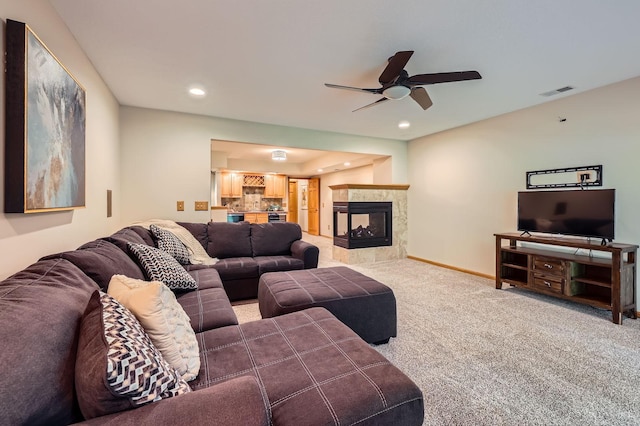 58 Garden Dr, Burnsville, MN 55337 - living area featuring ceiling fan, carpet floors, recessed lighting, a tiled fireplace, and baseboards