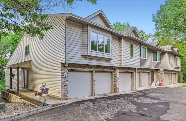 58 Garden Dr, Burnsville, MN 55337 - view of front of house with a garage and driveway