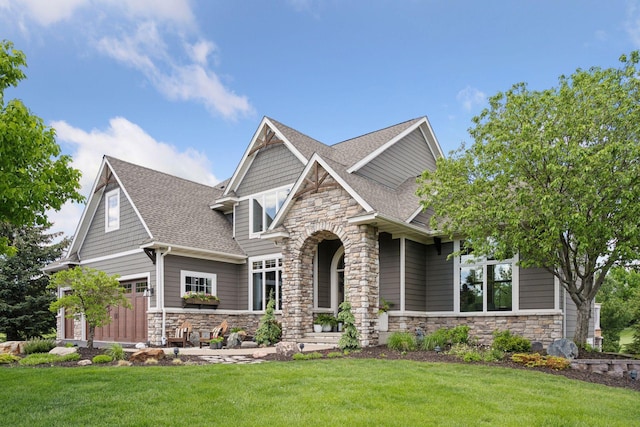 19820 Schutte Farm Rd, Corcoran, MN 55340 - craftsman-style home with stone siding, a shingled roof, and a front yard