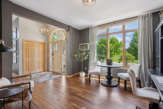 19820 Schutte Farm Rd, Corcoran, MN 55340 - entrance foyer with a chandelier, baseboards, and hardwood / wood-style floors