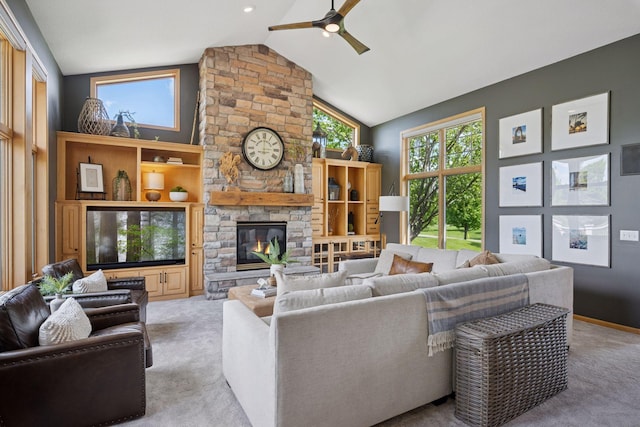 19820 Schutte Farm Rd, Corcoran, MN 55340 - carpeted living room featuring ceiling fan, a stone fireplace, and high vaulted ceiling