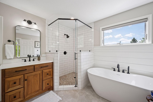 19820 Schutte Farm Rd, Corcoran, MN 55340 - full bath with a freestanding tub, a stall shower, vanity, and tile patterned floors