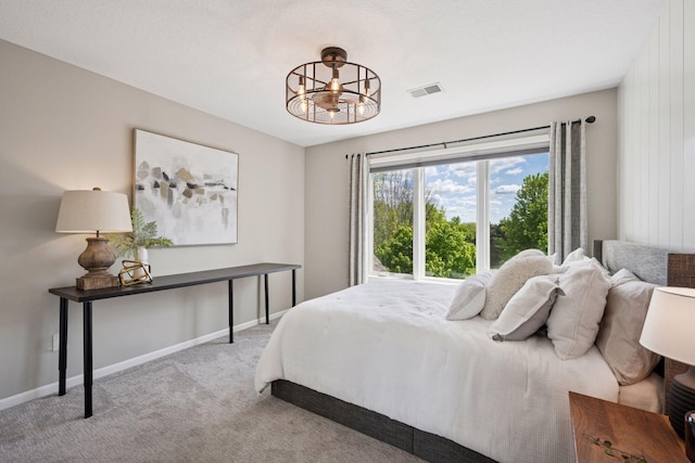 19820 Schutte Farm Rd, Corcoran, MN 55340 - carpeted bedroom featuring a chandelier and baseboards