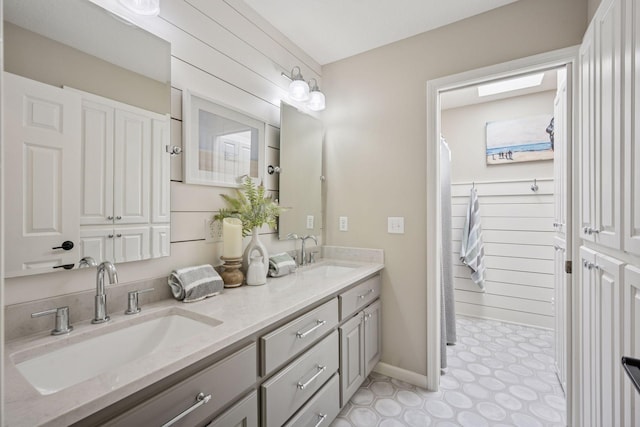 19820 Schutte Farm Rd, Corcoran, MN 55340 - full bathroom with double vanity and baseboards