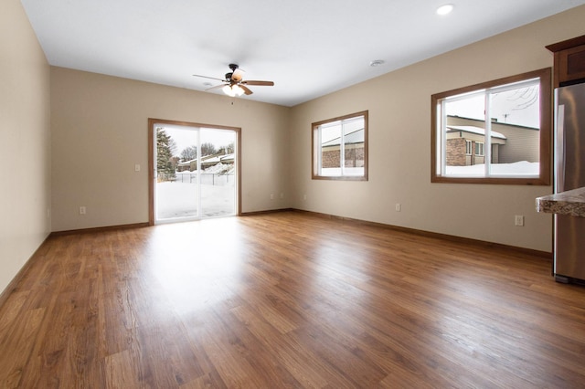 411 Bullis St, Kenyon, MN 55946 - spare room featuring a ceiling fan, wood finished floors, and recessed lighting