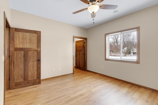 411 Bullis St, Kenyon, MN 55946 - unfurnished bedroom featuring light wood-style floors and baseboards