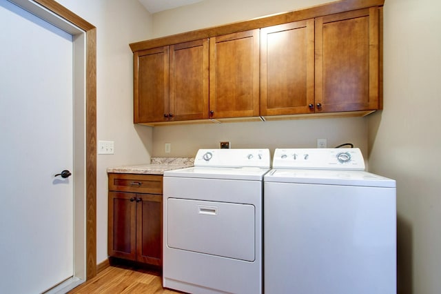 411 Bullis St, Kenyon, MN 55946 - washroom with cabinet space, washing machine and dryer, and light wood finished floors