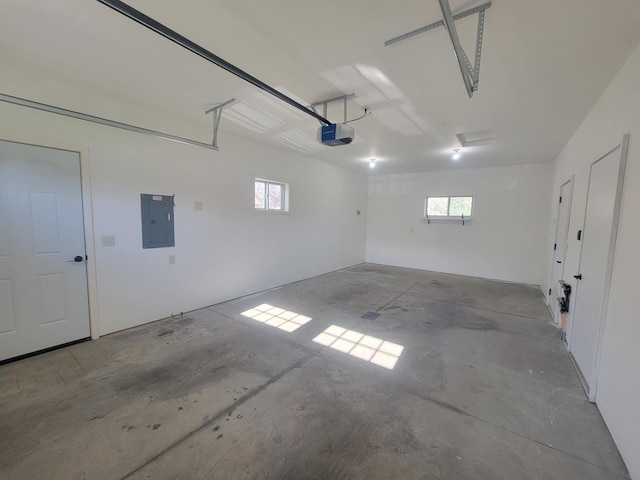 411 Bullis St, Kenyon, MN 55946 - garage featuring electric panel and a garage door opener