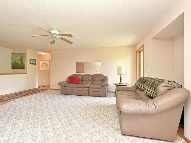 38850 Christie Ln, Cohasset, MN 55721 - living area with a ceiling fan, a textured ceiling, and baseboards