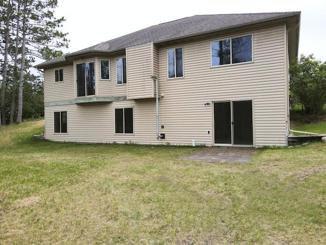 38850 Christie Ln, Cohasset, MN 55721 - rear view of house with a yard and a patio area