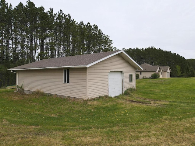 38850 Christie Ln, Cohasset, MN 55721 - detached garage featuring a forest view