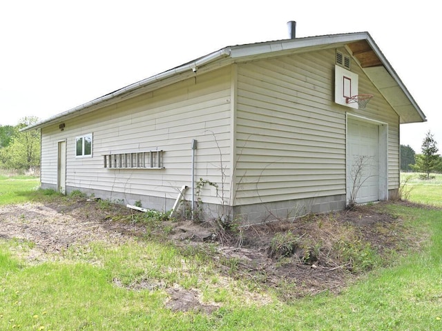 38850 Christie Ln, Cohasset, MN 55721 - view of home's exterior with a garage and an outdoor structure