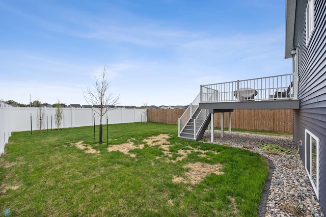 view of yard with stairway and a wooden deck