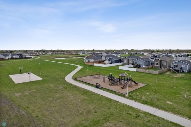 view of community featuring a residential view and a yard